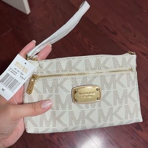 Michael Kors wristlet with tags